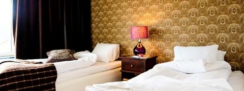 thomassonsgard-lagenhet-sovrum-konferensboende-are